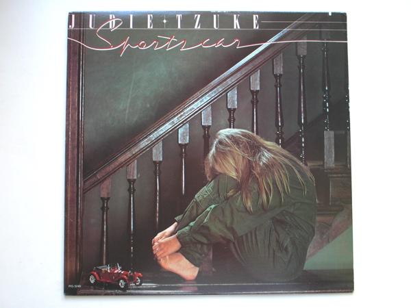Judie Tzuke Sports Car LP Rocket PIG3249 EX/EX 1980 US pressing, with inner, sleeve is cut at top edge (to mark it for export)."