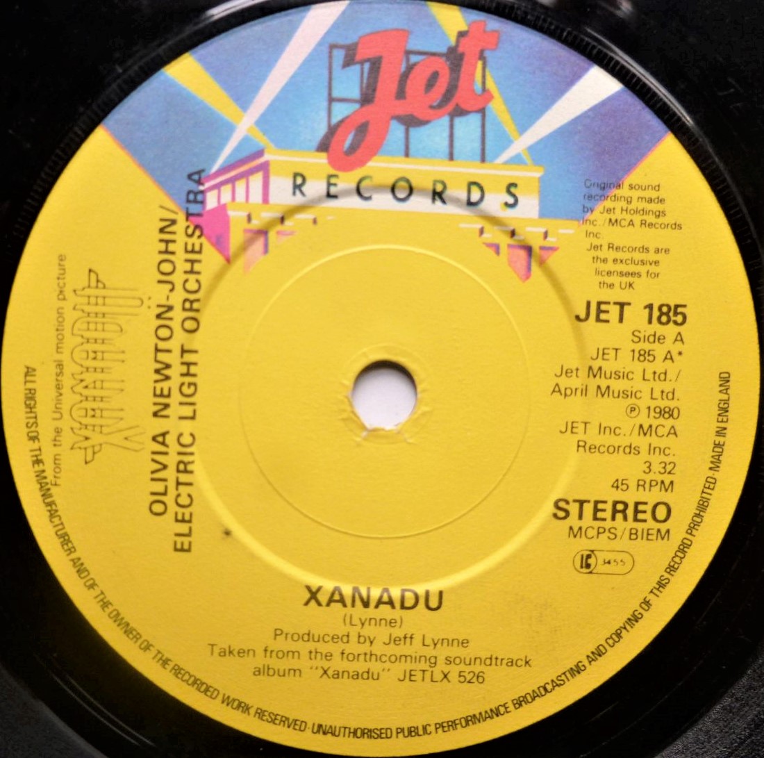 Olivia Newton John Xanadu 7" Jet JET185 EX 1980 a-side with ELO, The die-cut picture sleeve is made from thin paper and is quite creased but it is VG." - Image 2