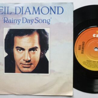 Neil Diamond Rainy Day Song 7" CBS A2033 EX/EX 1981 picture sleeve has small number written inside rear opening, there is handwritten number on side one label and 2mm drill hole in label rim