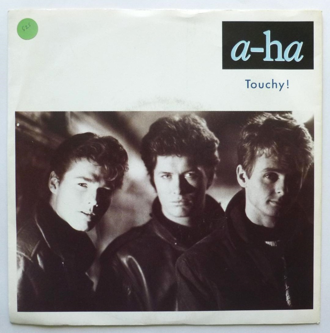 A-HA Touchy 7" Warner Bros W7749 EX/VG 1988 picture sleeve has small green sticker on front, white paper label - Image 2