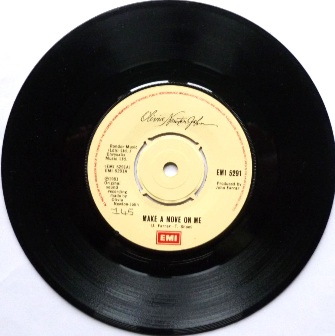 Olivia Newton John Make A Move On Me 7" EMI EMI5291 EX 1981 there is handwritten number on label and 2mm drill hole in label rim