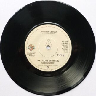 Doobie Brothers One Step Closer 7" Warner Bros K17707 EX 1980 there is writing on both sides of label and 2mm drill hole in label rim