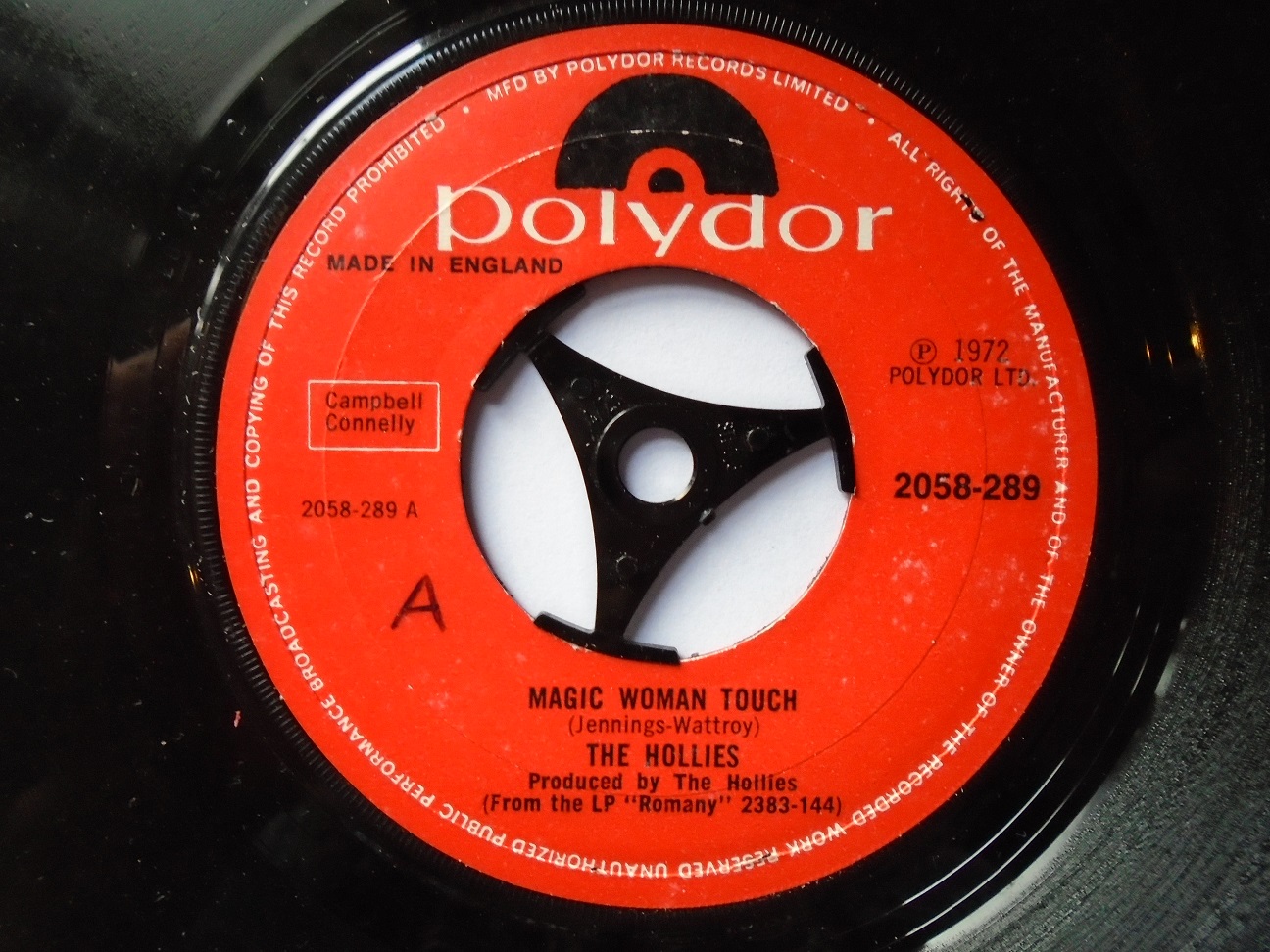 Hollies Magic Woman Touch 7" Polydor 2058289 EX 1972 record has a machine-cut centre and the a-side label both sides, on the side two label Magic Woman Touch has been crossed out and B is written on the label."