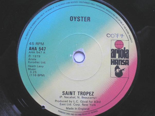 Oyster Saint Tropez 7" Ariola AHA347 EX 1979 there is handwritten number on label and 2mm drill hole in label rim