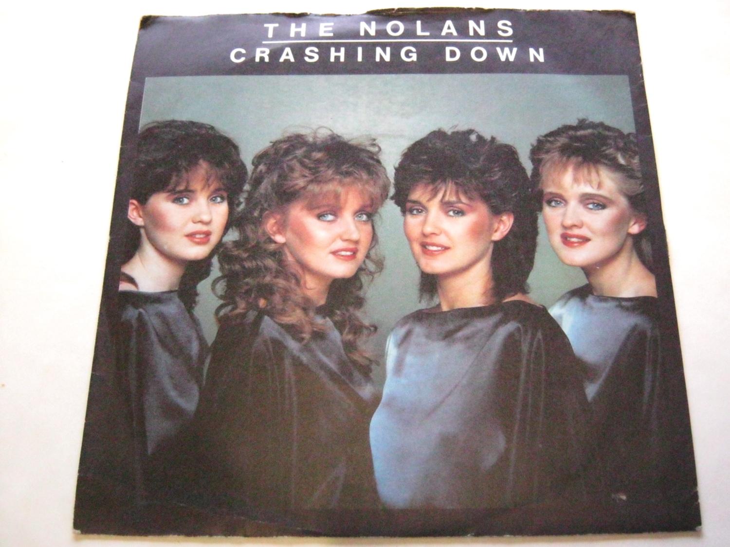Nolan Sisters Crashing Down 7" Epic EPCA2378 EX/VG 1982 there is handwritten number on label there is 2mm drill hole in label rim